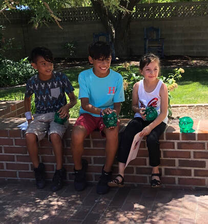 Three Prosperity Kids savers with their piggy banks!   Photo credit: Prosperity Works